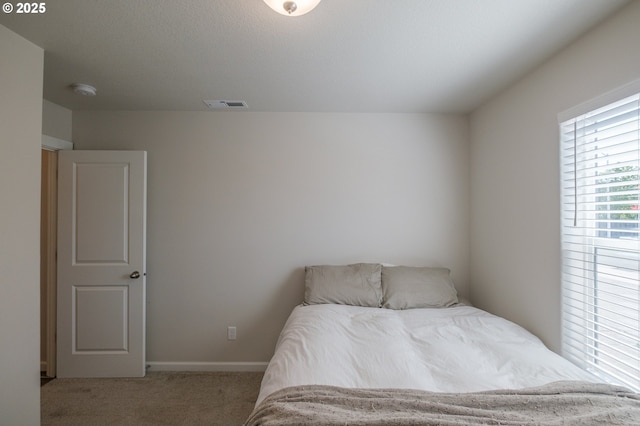 414 SE Ray St, Dallas, OR 97338 - bedroom featuring carpet floors, baseboards, and visible vents