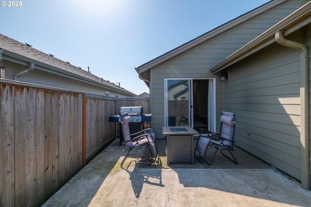 414 SE Ray St, Dallas, OR 97338 - view of patio / terrace with an outdoor fire pit and fence