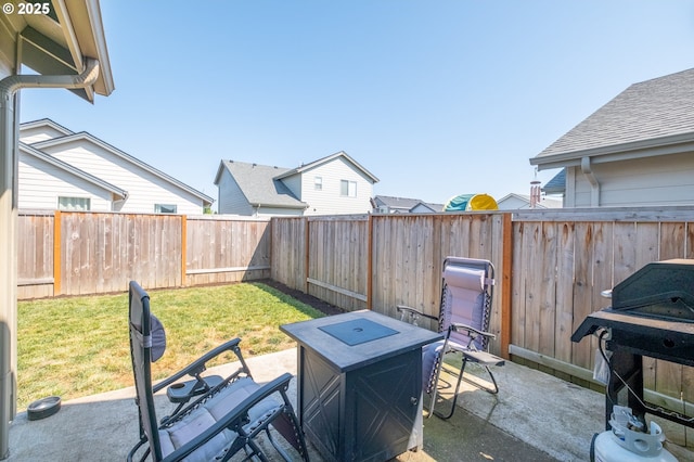414 SE Ray St, Dallas, OR 97338 - view of patio featuring a fenced backyard, grilling area, and an outdoor fire pit