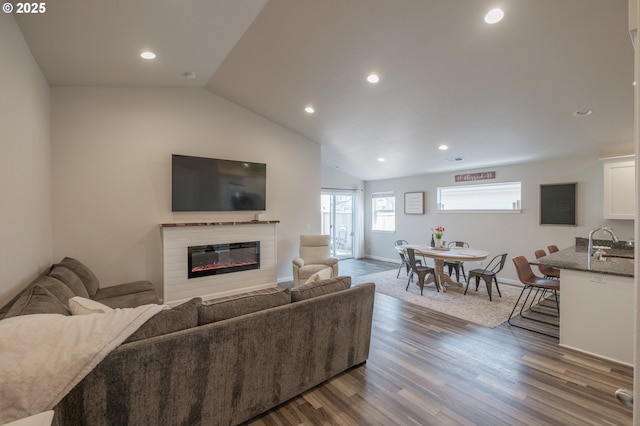 414 SE Ray St, Dallas, OR 97338 - living room featuring a glass covered fireplace, recessed lighting, and dark wood-style flooring