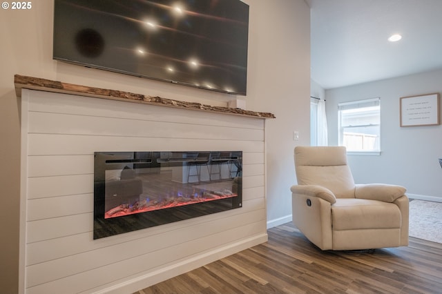 414 SE Ray St, Dallas, OR 97338 - interior space with baseboards, a glass covered fireplace, recessed lighting, and wood finished floors