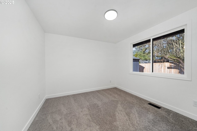 empty room with carpet flooring