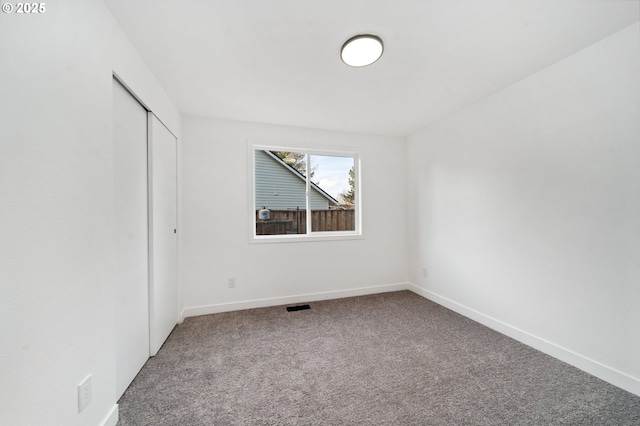 empty room featuring carpet