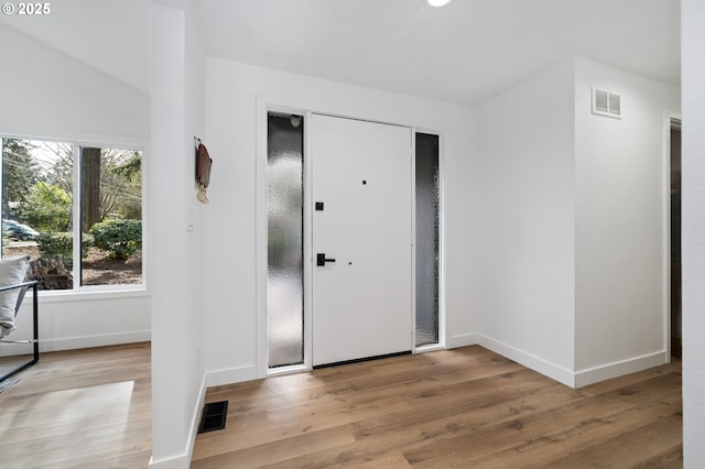 foyer with light hardwood / wood-style floors