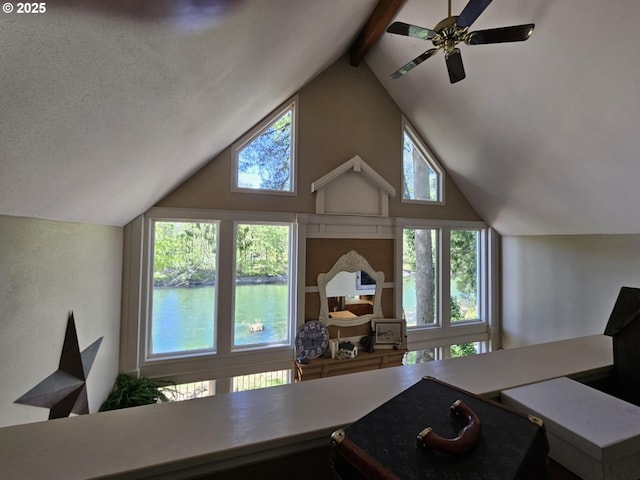 office space featuring beam ceiling, high vaulted ceiling, plenty of natural light, and ceiling fan