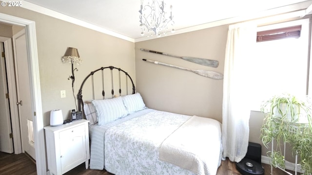 bedroom with a chandelier, dark wood-style flooring, ornamental molding, and multiple windows