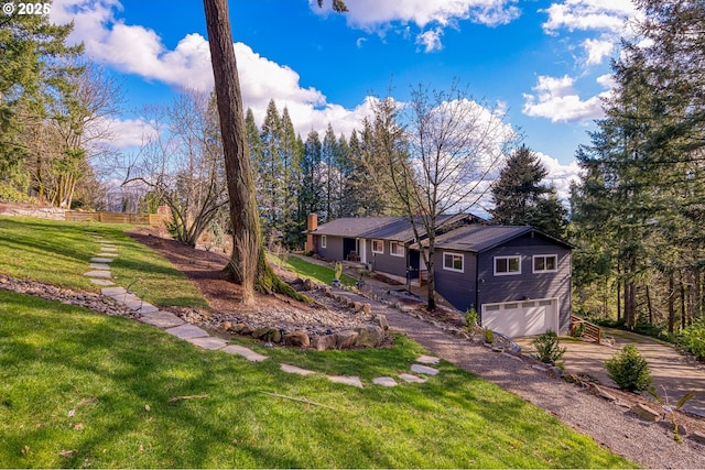 10951 SE Valley View Ter, Happy Valley, OR 97086 - view of front of home featuring a garage, driveway, and a chimney