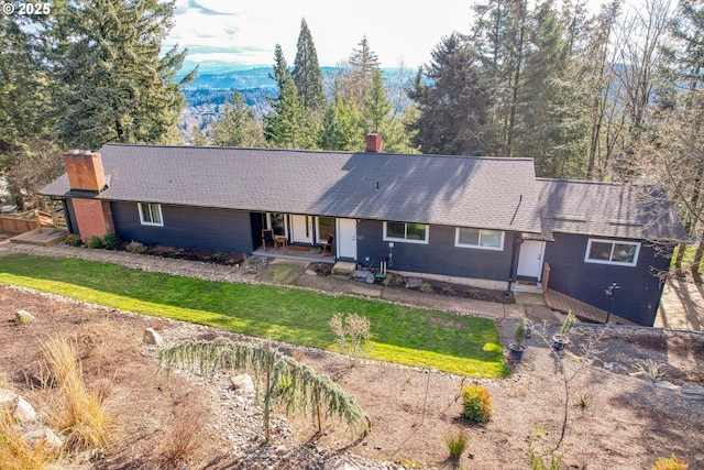 10951 SE Valley View Ter, Happy Valley, OR 97086 - ranch-style home with a chimney, a front yard, a shingled roof, and a mountain view