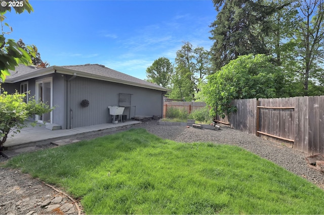 view of yard featuring a wooden deck and a sink