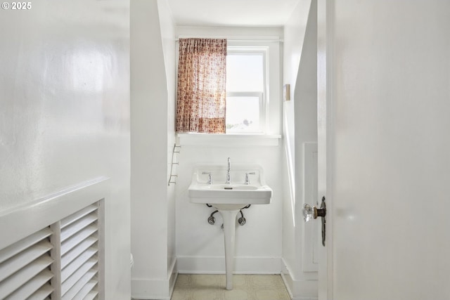 bathroom featuring baseboards