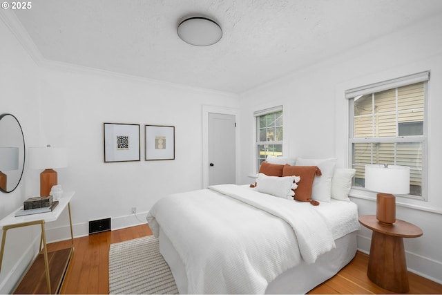 3321 NE 13th Ave, Portland, OR 97212 - bedroom featuring wood finished floors, ornamental molding, and baseboards