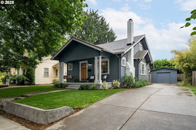 3321 NE 13th Ave, Portland, OR 97212 - view of front facade featuring a porch, an outbuilding, driveway, a front yard, and a chimney