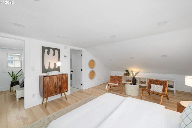 3321 NE 13th Ave, Portland, OR 97212 - bedroom featuring light wood-type flooring, lofted ceiling, and baseboards