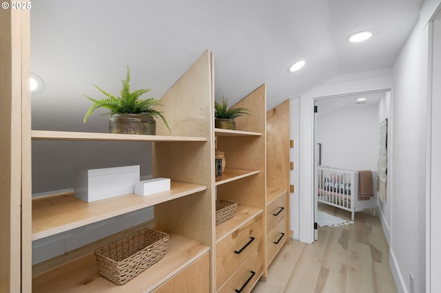 3321 NE 13th Ave, Portland, OR 97212 - spacious closet with wood finished floors and vaulted ceiling