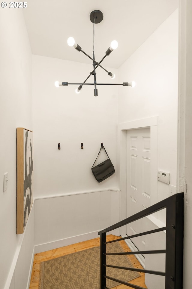 3321 NE 13th Ave, Portland, OR 97212 - mudroom with a chandelier, wood finished floors, and baseboards