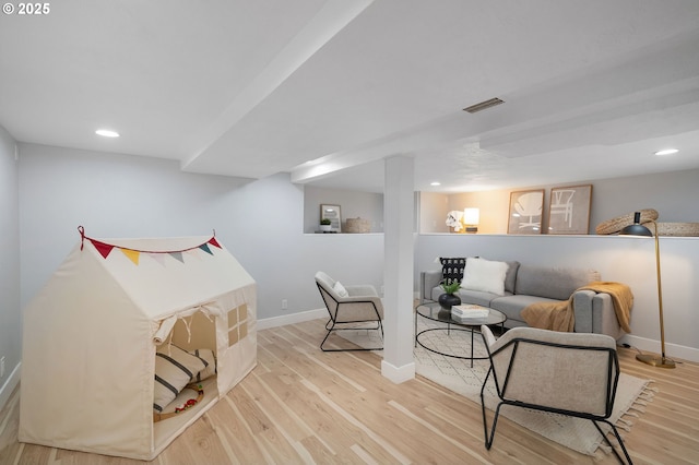 3321 NE 13th Ave, Portland, OR 97212 - living area featuring wood finished floors, baseboards, and recessed lighting