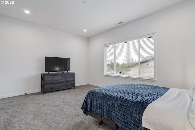 carpeted bedroom featuring recessed lighting, visible vents, and baseboards