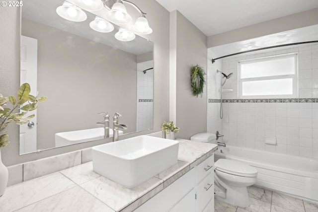 bathroom with shower / bathing tub combination, toilet, marble finish floor, and vanity