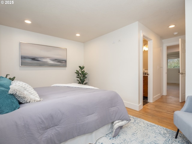 bedroom with recessed lighting, baseboards, and light wood finished floors