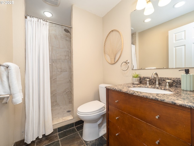 bathroom featuring tiled shower, recessed lighting, toilet, and vanity