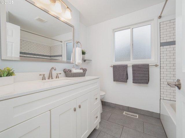 bathroom featuring tile patterned floors, visible vents, toilet, and vanity