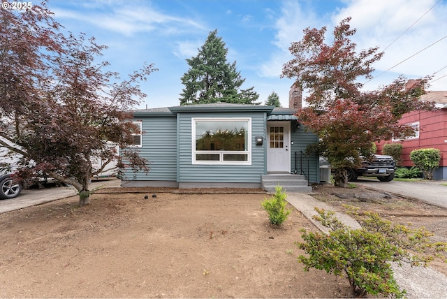 6914 N Campbell Ave, Portland, OR 97217 - view of front of house with a chimney