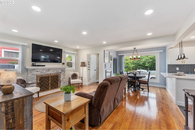 6914 N Campbell Ave, Portland, OR 97217 - living area featuring light wood-type flooring, a fireplace, plenty of natural light, and recessed lighting