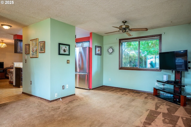 1363 SE 135th Ave, Portland, OR 97233 - unfurnished living room with carpet flooring, ceiling fan, baseboards, and a textured ceiling