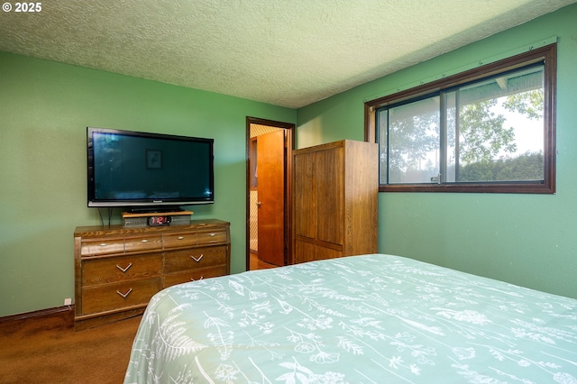 1363 SE 135th Ave, Portland, OR 97233 - bedroom with dark colored carpet, a textured ceiling, and baseboards