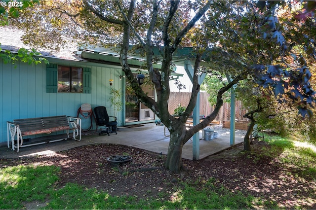 1363 SE 135th Ave, Portland, OR 97233 - back of property with a patio area and board and batten siding