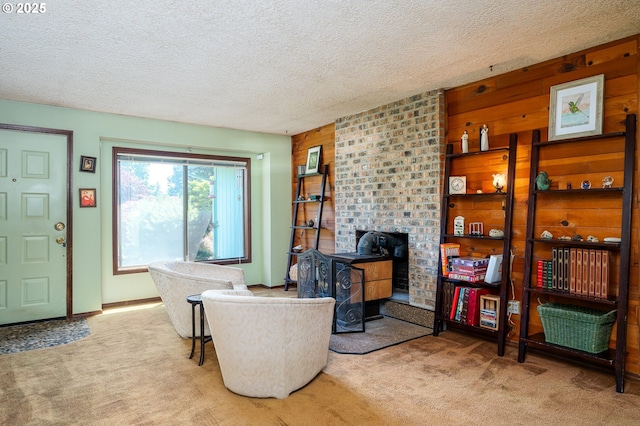 1363 SE 135th Ave, Portland, OR 97233 - carpeted living room featuring a wood stove and a textured ceiling