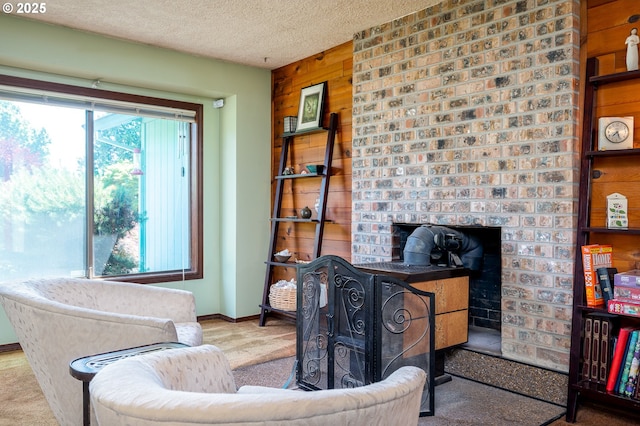 1363 SE 135th Ave, Portland, OR 97233 - living area featuring carpet, a textured ceiling, wood walls, and baseboards
