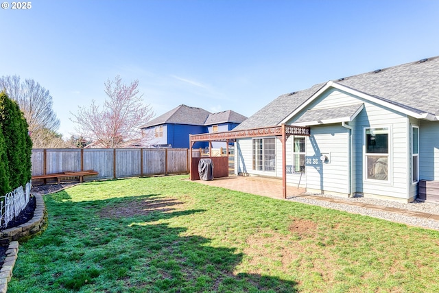 view of yard with a patio and a fenced backyard