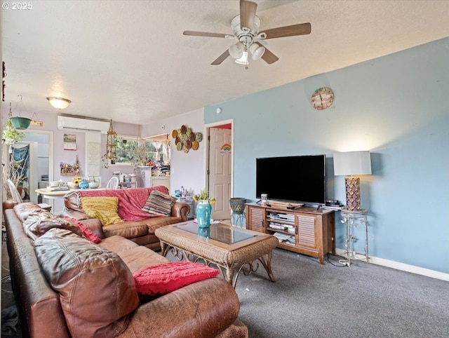 living room featuring a ceiling fan, carpet flooring, a textured ceiling, and baseboards