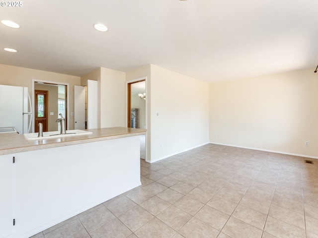 651 SW Westview Dr, Mcminnville, OR 97128 - kitchen with freestanding refrigerator, recessed lighting, light tile patterned floors, and light countertops