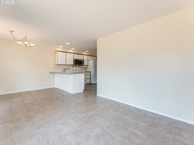 651 SW Westview Dr, Mcminnville, OR 97128 - unfurnished living room featuring a chandelier and recessed lighting