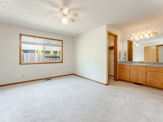 651 SW Westview Dr, Mcminnville, OR 97128 - unfurnished bedroom with light carpet, a walk in closet, ceiling fan, and a closet