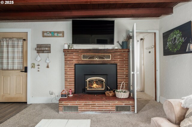 1844 NW 33rd St, Lincoln City, OR 97367 - carpeted living area featuring beam ceiling, wooden ceiling, and a brick fireplace