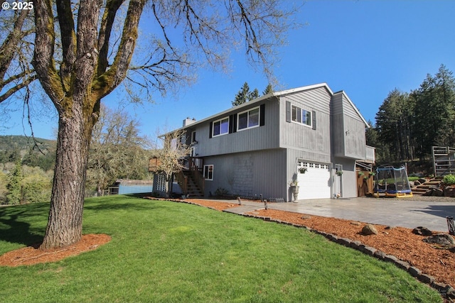 38185 SW Laurelwood Rd, Gaston, OR 97119 - view of front of home with stairway, driveway, an attached garage, a front lawn, and a chimney