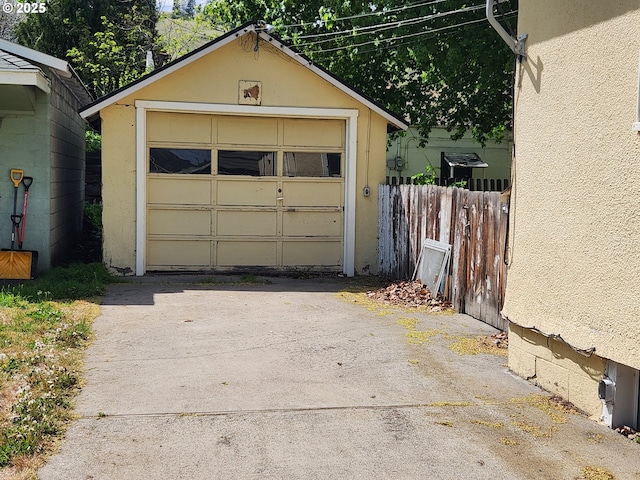 1914 1st St, La Grande, OR 97850 - detached garage featuring asphalt driveway and fence
