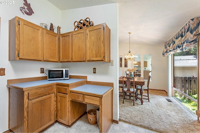1430 NW 19th St, Gresham, OR 97030 - kitchen with stainless steel microwave, plenty of natural light, light countertops, and light colored carpet