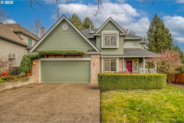 view of front of home with a garage, a front lawn, and an AC wall unit