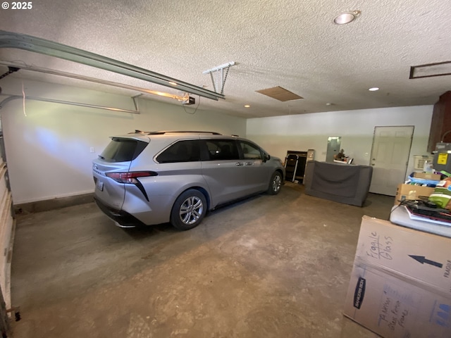 garage featuring recessed lighting and a garage door opener