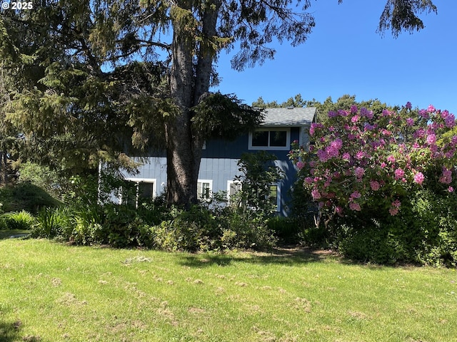 view of home's exterior featuring a lawn