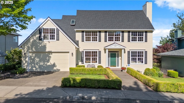 1365 NW 96th Ave, Portland, OR 97229 - colonial inspired home featuring concrete driveway, a chimney, and a shingled roof
