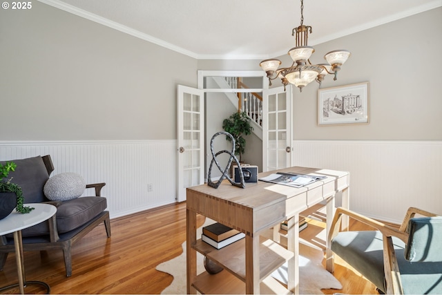 1365 NW 96th Ave, Portland, OR 97229 - office with wainscoting, light wood finished floors, ornamental molding, a chandelier, and french doors