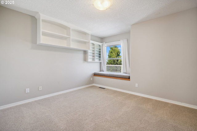 1365 NW 96th Ave, Portland, OR 97229 - unfurnished room featuring carpet flooring, a textured ceiling, and baseboards