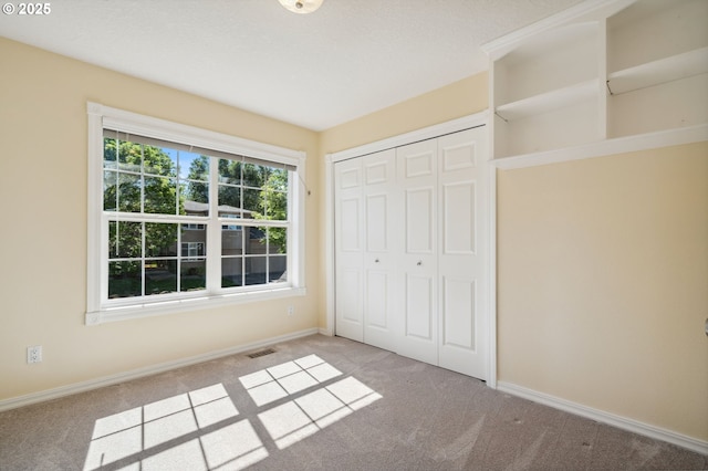1365 NW 96th Ave, Portland, OR 97229 - unfurnished bedroom with carpet flooring, baseboards, and a closet