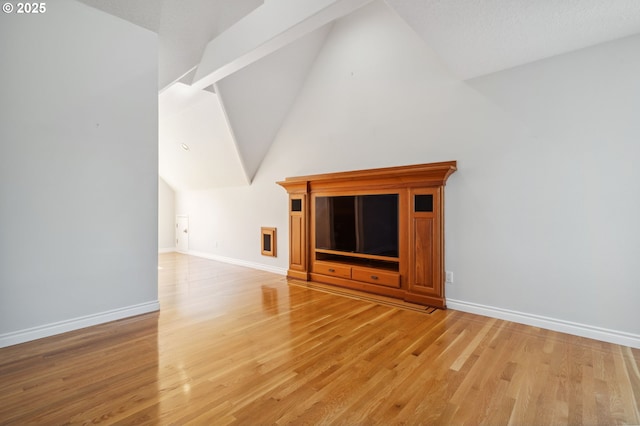 1365 NW 96th Ave, Portland, OR 97229 - unfurnished living room featuring vaulted ceiling, light wood-style flooring, and baseboards