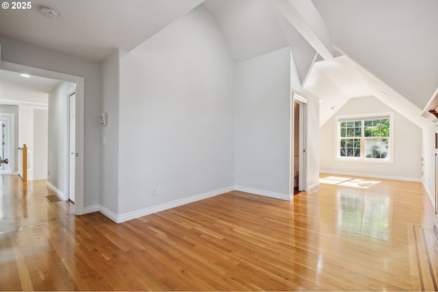 1365 NW 96th Ave, Portland, OR 97229 - additional living space with vaulted ceiling, light wood-style floors, and baseboards